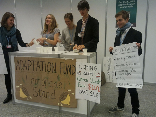 Youth activists organising a mock lemonade sale to get money for the Green Climate Fund to highlight the lack of serious commitments. Credit: Claudia Ciobanu/IPS