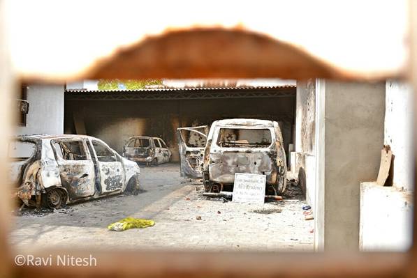 Torched vehicles in a muslim house.jpg