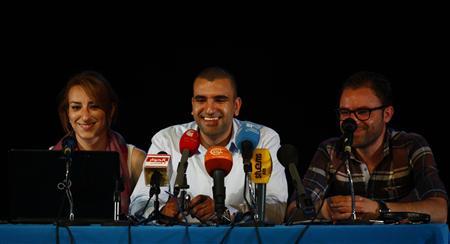 Mohamed Bennour (C), coordinator of the Tunisia Tamarod (rebel) movement, speaks at a news conference in Tunis July 3, 2013. REUTERS/Zoubeir Souissi