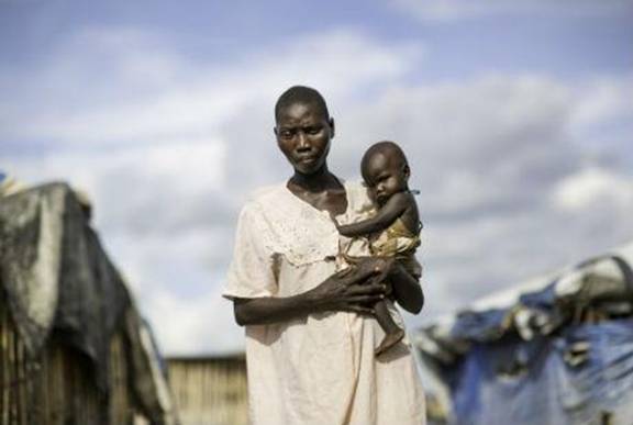 Stima, 18 and her baby Moses. Photo: Keiran Doherty/Oxfam