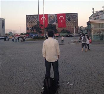 This DHA photo shows 'standing man' as he started the silent act of resistance, before he was joined by a large group.