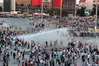 Riot police intervened with water cannons around 8:35 p.m. local time to the crowd peacefully gathered at the Taksim Square. DHA photo